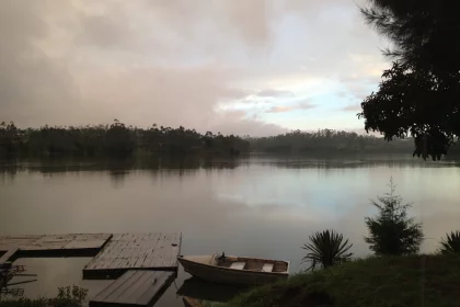Photo of a boat is sitting on the shore of a lake, Indonesia, February 2013, Reinder Nijhoff