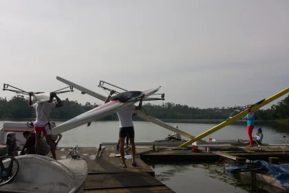 Photo of a couple of men standing on top of a wooden dock, Indonesia, February 2013, Reinder Nijhoff