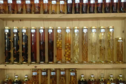 Photo of a shelf filled with lots of bottles of liquid, WC Chungju, South Korea, August 2013, Reinder Nijhoff