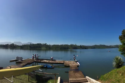 Photo of a group of people standing on a dock next to a body of water, Indonesia, August 2014, Reinder Nijhoff