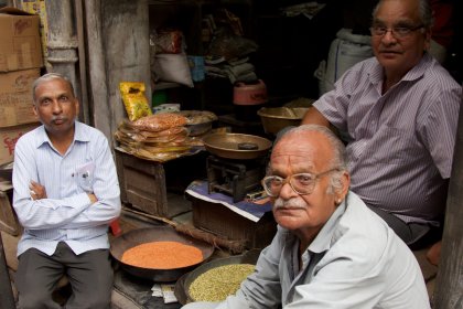 Photo of three men sitting in front of a store, Myanmar, India, Nepal, June 2015, Reinder Nijhoff