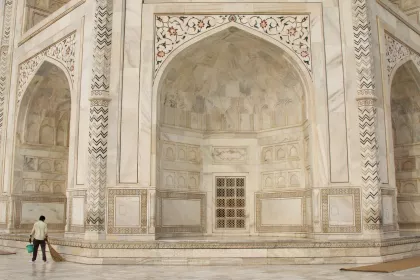 Photo of a man standing in front of a white building, Myanmar, India, Nepal, June 2015, Reinder Nijhoff