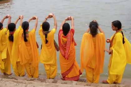 Photo of a group of women standing next to a body of water, Myanmar, India, Nepal, June 2015, Reinder Nijhoff