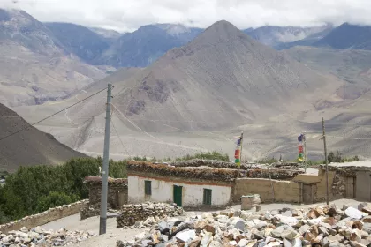 Photo of a mountain range with a building in the foreground, Myanmar, India, Nepal, June 2015, Reinder Nijhoff