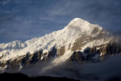 Photo of a snow covered mountain with clouds in the foreground, Myanmar, India, Nepal, June 2015, Reinder Nijhoff