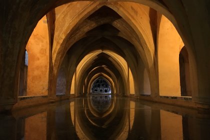 Photo of a long tunnel with a reflection in the water, Seville, February 2016, Reinder Nijhoff