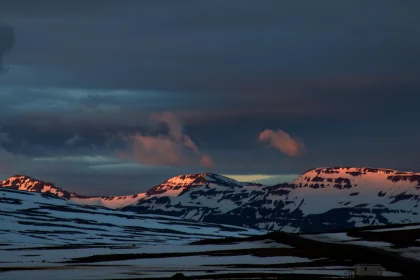 Photo of a snow covered mountain range under a cloudy sky, Iceland, June 2016, Reinder Nijhoff