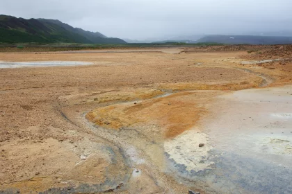 Photo of a large open field with a mountain in the background, Iceland, June 2016, Reinder Nijhoff