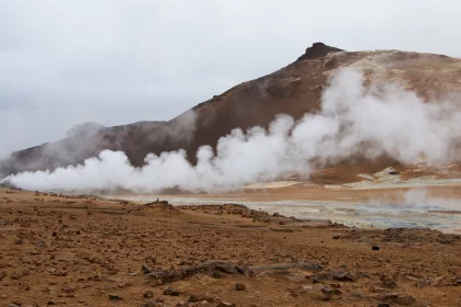Photo of steam rises from the ground near a mountain, Iceland, June 2016, Reinder Nijhoff