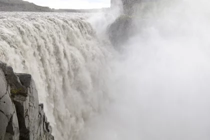Photo of a large waterfall with water pouring out of it, Iceland, June 2016, Reinder Nijhoff