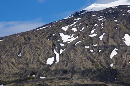 Photo of a large mountain covered in snow under a blue sky, Iceland, June 2016, Reinder Nijhoff