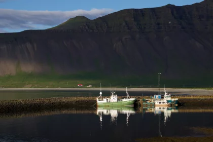 Photo of a couple of boats that are sitting in the water, Iceland, June 2016, Reinder Nijhoff
