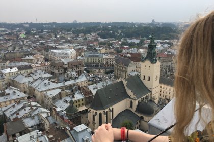 Photo of a woman standing on top of a tall building, Lviv, Ukraine, September 2016, Reinder Nijhoff