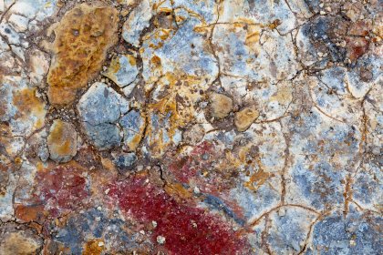 Photo of a close up of a rock with a red substance on it, Iceland, May 2017, Reinder Nijhoff