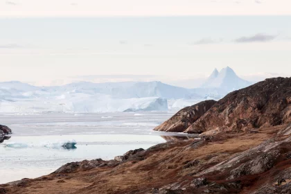 Photo of a large iceberg floating on top of a body of water, Greenland, October 2017, Reinder Nijhoff