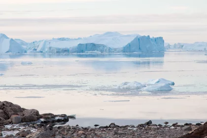 Photo of a group of icebergs floating on top of a body of water, Greenland, October 2017, Reinder Nijhoff