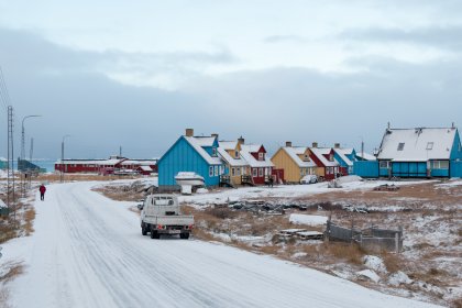 Photo of a truck driving down a snow covered road, Greenland, October 2017, Reinder Nijhoff