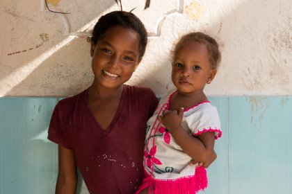 Photo of a couple of young girls standing next to each other, Santa Cruz del Islote, Colombia, December 2017, Reinder Nijhoff