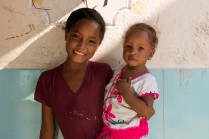 Photo of a couple of young girls standing next to each other, Santa Cruz del Islote, Colombia, December 2017, Reinder Nijhoff