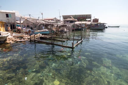 Photo of a body of water with a bunch of boats in it, Santa Cruz del Islote, Colombia, December 2017, Reinder Nijhoff