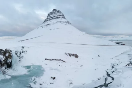 Photo of a snowy mountain with a stream running through it, Winter Iceland, January 2018, Reinder Nijhoff