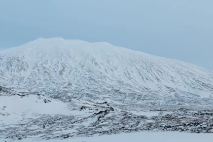 Photo of a mountain covered in snow on a cloudy day, Winter Iceland, January 2018, Reinder Nijhoff