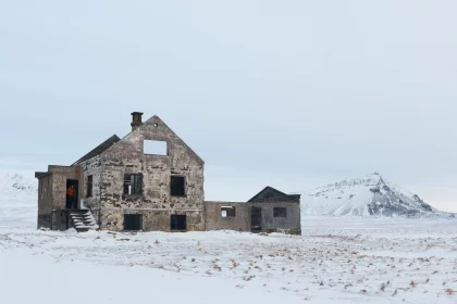 Photo of an old building in the middle of a snowy field, Winter Iceland, January 2018, Reinder Nijhoff