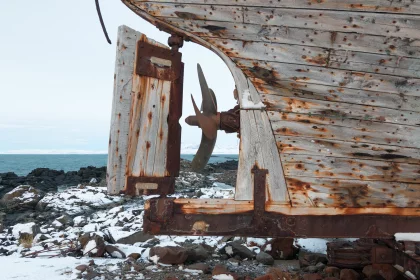 Photo of an old boat sitting on top of a rocky beach, Winter Iceland, January 2018, Reinder Nijhoff
