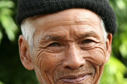 Photo of an old man with a black hat on his head, Thailand, Laos, Cambodja & Vietnam, November 2005, Reinder Nijhoff