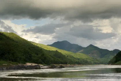 Photo of a river running through a lush green valley, Thailand, Laos, Cambodja & Vietnam, November 2005, Reinder Nijhoff