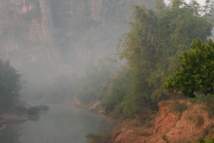 Photo of a body of water surrounded by trees and mountains, Thailand, Laos, Cambodja & Vietnam, November 2005, Reinder Nijhoff
