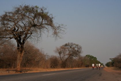 Photo of a group of people riding bikes down a road, Zimbabwe, Mozambique & South Africa, December 2006, Reinder Nijhoff