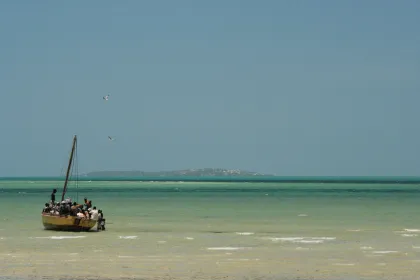 Photo of a group of people on a small boat in the water, Zimbabwe, Mozambique & South Africa, December 2006, Reinder Nijhoff
