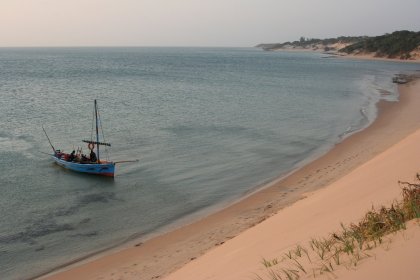 Photo of a boat floating on top of a sandy beach, Zimbabwe, Mozambique & South Africa, December 2006, Reinder Nijhoff