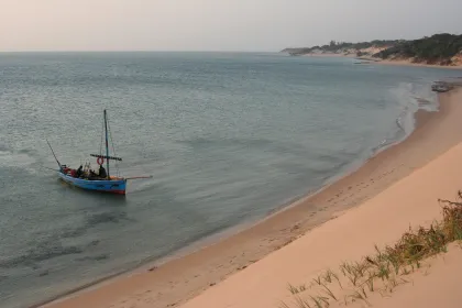 Photo of a small boat floating on top of a sandy beach, Zimbabwe, Mozambique & South Africa, December 2006, Reinder Nijhoff