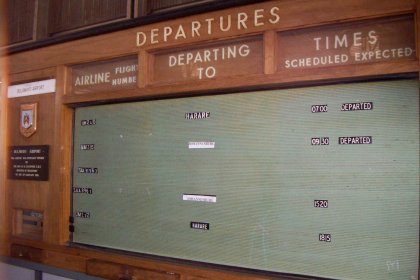 Photo of a display of departure times on a wall, Zimbabwe, Mozambique & South Africa, December 2006, Reinder Nijhoff