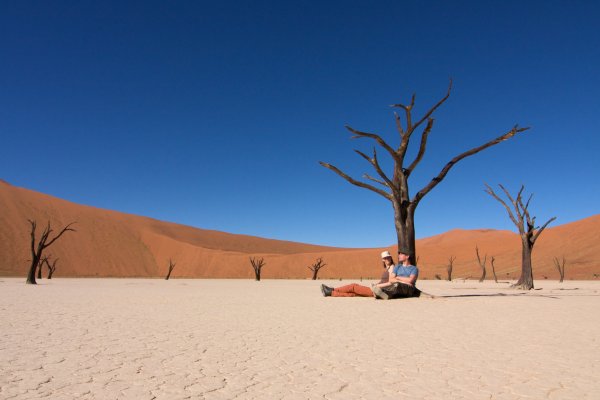 Photo of a person sitting in the middle of a desert, Namibia, May 2008, Reinder Nijhoff