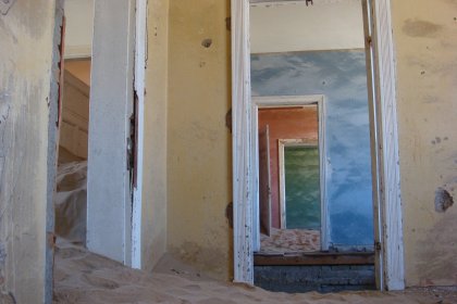 Photo of an empty room with a door and a mirror, Namibia, May 2008, Reinder Nijhoff