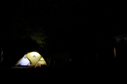 Photo of a tent is lit up at night in the dark, Namibia, May 2008, Reinder Nijhoff