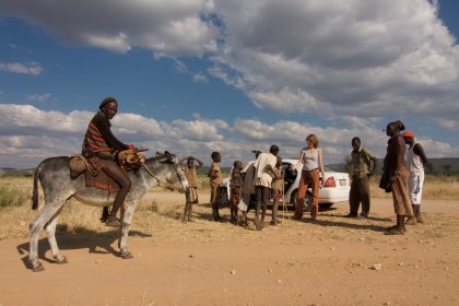 Photo of a group of people standing around a donkey, Namibia, May 2008, Reinder Nijhoff