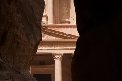 Photo of a view of a building through a gap in a rock, Jordan, Syria, Lebanon, May 2009, Reinder Nijhoff
