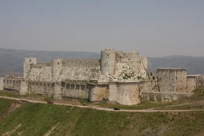 Photo of a large castle sitting on top of a lush green hillside, Jordan, Syria, Lebanon, May 2009, Reinder Nijhoff
